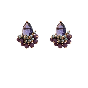 Vintage water drop earrings with purple crystals and gold accents on a white background