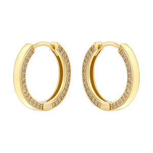 Close-up of golden hoop earrings featuring paved clear cubic zirconia stones in a pair