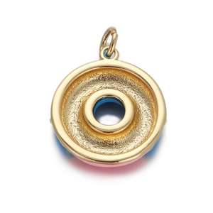 Detailed view of donut charm pendant with dark blue zircon and pink enamel in gold plating