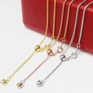 Detailed view of S925 sterling silver ball post earrings with adjustable box chains and hearts