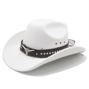 Close-up of white western felt cowboy hat with silver bull head and studded leather band