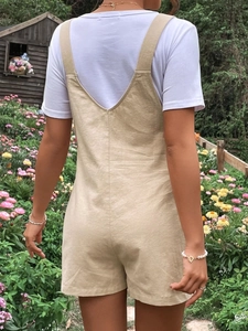 Beige cotton linen maternity overalls with adjustable straps shown from the back view