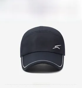 Close-up of mesh baseball cap featuring reflective silver logo and grey piping on brim