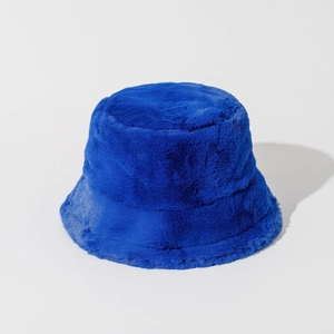 Detailed close-up of thick blue faux fur fisherman hat showing soft plush texture