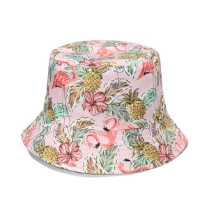 Pink tropical bucket hat with flamingo and pineapple print for summer beach sun protection