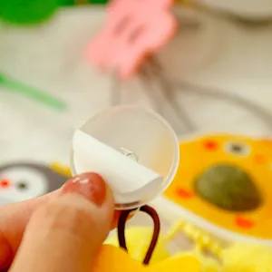 Adhesive hook with elastic cord for hanging cat toys, featuring strong traceless mounting