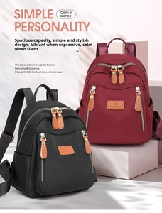 Front view of nylon backpacks in black and burgundy with multiple zipper pockets