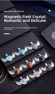 Macro detail of nine colorful heart-shaped crystal pendants with silver wing accents