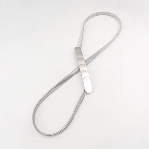 Detail of silver elastic metal spring belt with a flat segmented buckle on white background