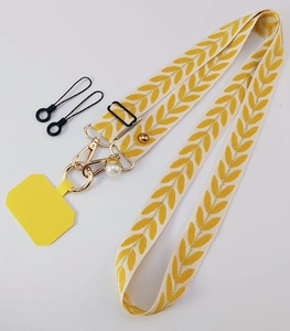 Detail of adjustable off-white woven phone strap with pearl charm and gold-toned metal clasps