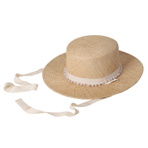 Flat top straw boater hat with pearl trim and long cream ribbons on white background