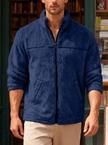 Detailed close-up of a navy polar fleece jacket with stand collar and front zipper