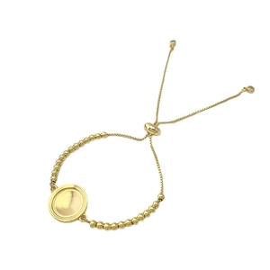 Adjustable golden heart and Saint Benedict bead bracelet with a circular base charm