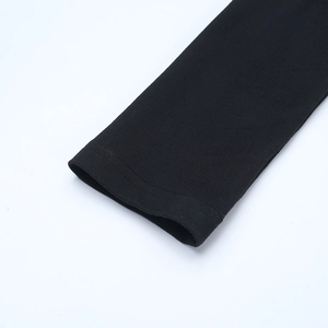 Close-up of black long sleeve cuff showing detailed double-needle stitching on fabric