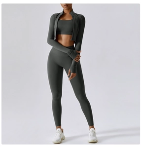 Detail of grey three-piece yoga set with thumb-hole jacket and high-waisted leggings