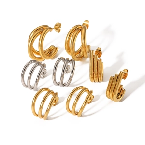 Minimalist 18k gold and silver multi-layer C-shaped hoop earrings in polished finish
