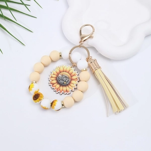 Detail of sunflower keychain with yellow tassel and Happy Mother's Day inscription