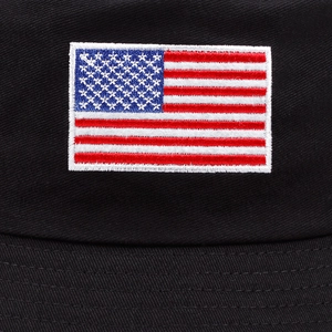 Black cotton bucket hat featuring high-quality embroidered American flag patch detail