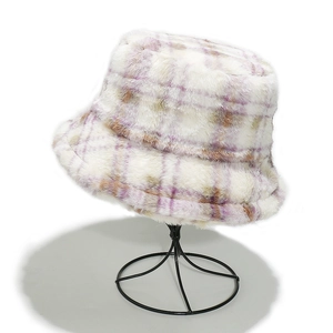 Detail of checkered faux fur bucket hat showing thick plush texture in purple and beige