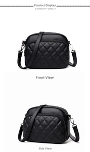 Detail of black quilted crossbody camera bag featuring silver zippers and dual compartments