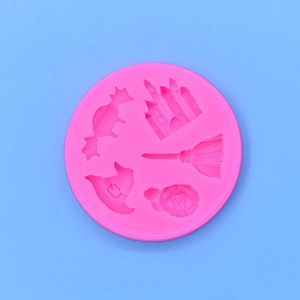 Pink silicone mold with Halloween castle, pumpkin, hat, bat, and broom motifs for baking