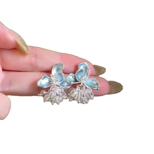 Handmade light blue enamel flower earrings with clusters of sparkling crystal beads