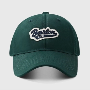 Detail of Barton 1768 embroidery on green cotton baseball cap with reinforced brim