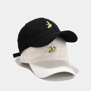Black and beige baseball caps with cute banana embroidery in soft cotton canvas