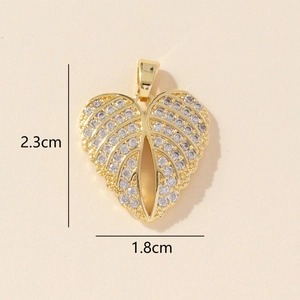 Detailed size view of gold heart pendant with micro-pave zircons, 2.3cm by 1.8cm