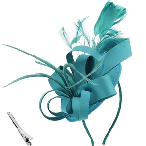 Teal fascinator detail with silk bow feathers and silver duckbill clip accessory