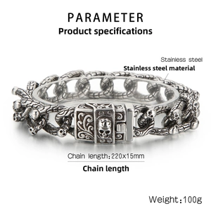 Detail of chunky stainless steel punk skull bracelet with vintage interlocking chain links