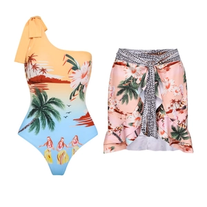 Detail of one-shoulder bikini top with bow and tropical coconut tree print sarong skirt