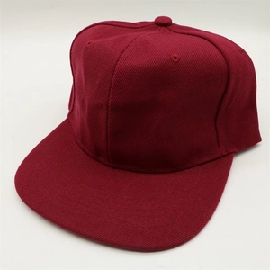 Detailed close-up of wine red snapback hat showing twill fabric texture and stitching