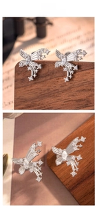 Macro shot of butterfly wing stud earrings with pavé set cubic zirconia in silver