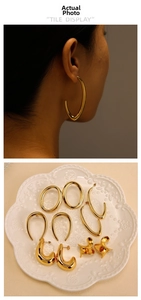 Detailed view of irregular 18K gold-plated stainless steel geometric hoop earrings set