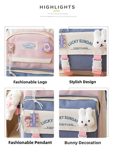 Detail view of pink and blue school backpack with plush bunny and decorative pendants