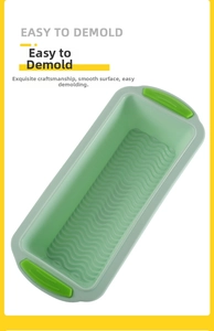 Detail of rectangular silicone toast mold with non-stick ripple texture and green handles