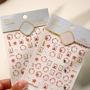 Self-adhesive nail stickers featuring gold-stamped cartoon rabbits and floral designs