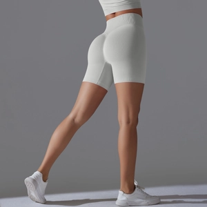 Detail of high-waisted seamless ribbed gym shorts showing peach lift and butt-sculpting fit