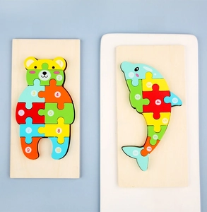 Close-up of bear and whale wooden number puzzles for kids early educational learning