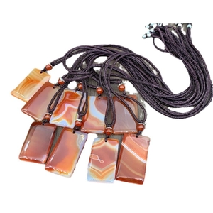Agate safety plaque necklaces with orange-red stones and dark brown nylon cords