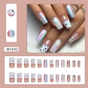 24-piece press-on nail set featuring heart patterns and holographic stripe designs