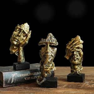 Three-piece gold abstract face sculptures on black bases for Nordic office art decor