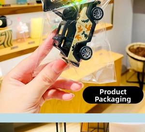 Detail showing cartoon camo jeep keychain packaged in a transparent protective bag
