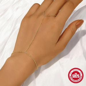 S925 sterling silver gold finger bracelet with delicate beads on white satin