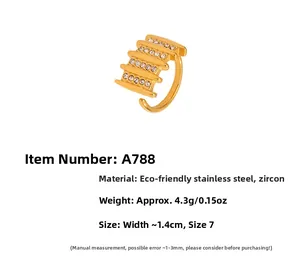Macro detail of gold-plated ridged ring featuring white zircon and size 7 measurement specs