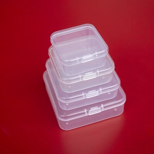 Vertical stack of four different sized transparent PP plastic storage boxes with lids