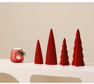 Detail of red flocked ceramic Christmas tree set with a Santa Claus themed candle holder