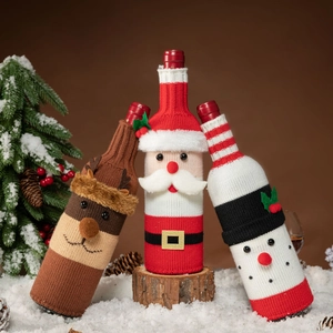 Knitted Christmas wine bottle covers featuring Santa Claus, snowman and reindeer designs