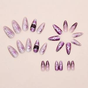 Detail of purple almond press-on nails featuring silver celestial star and moon patterns